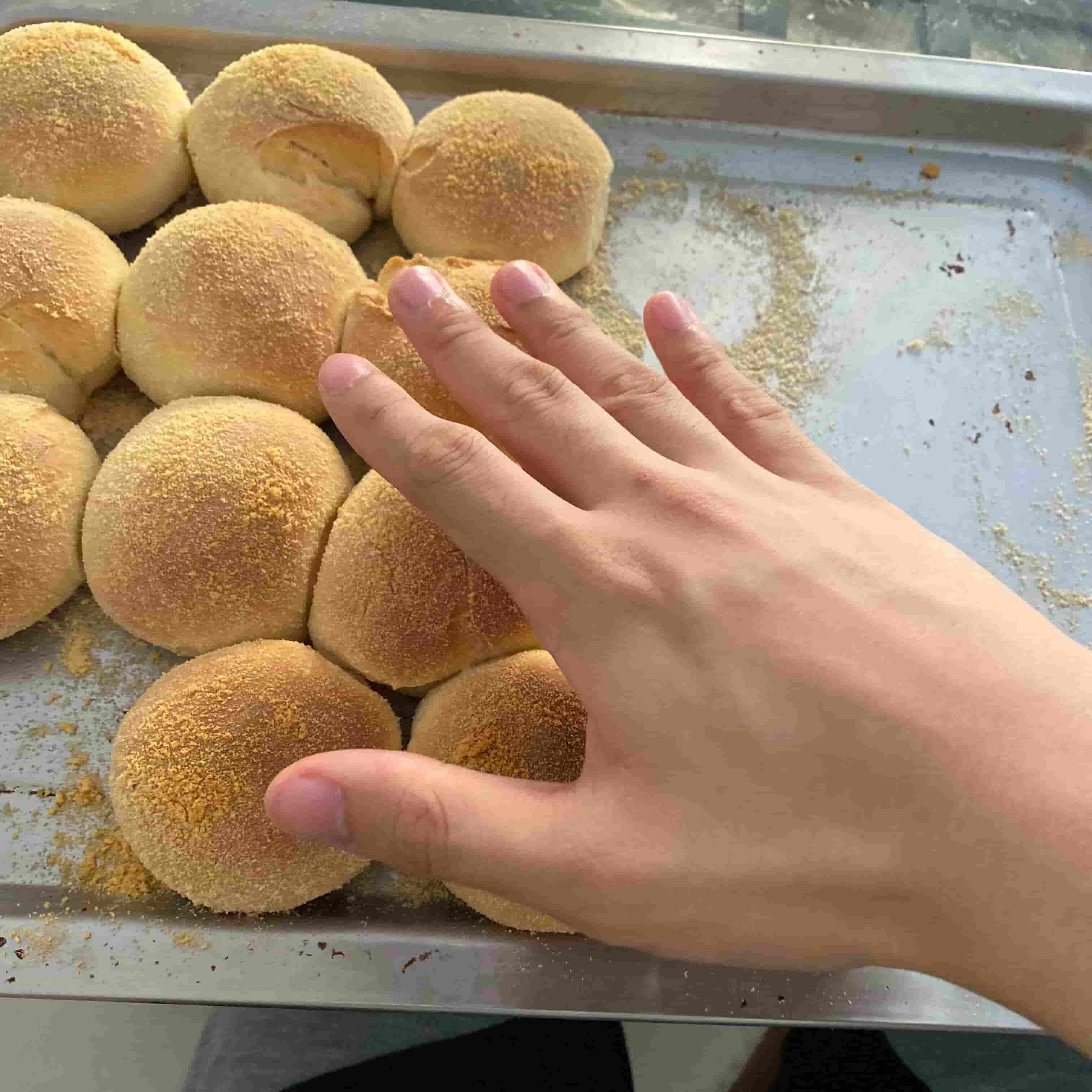 Pandesal with hand for scale...